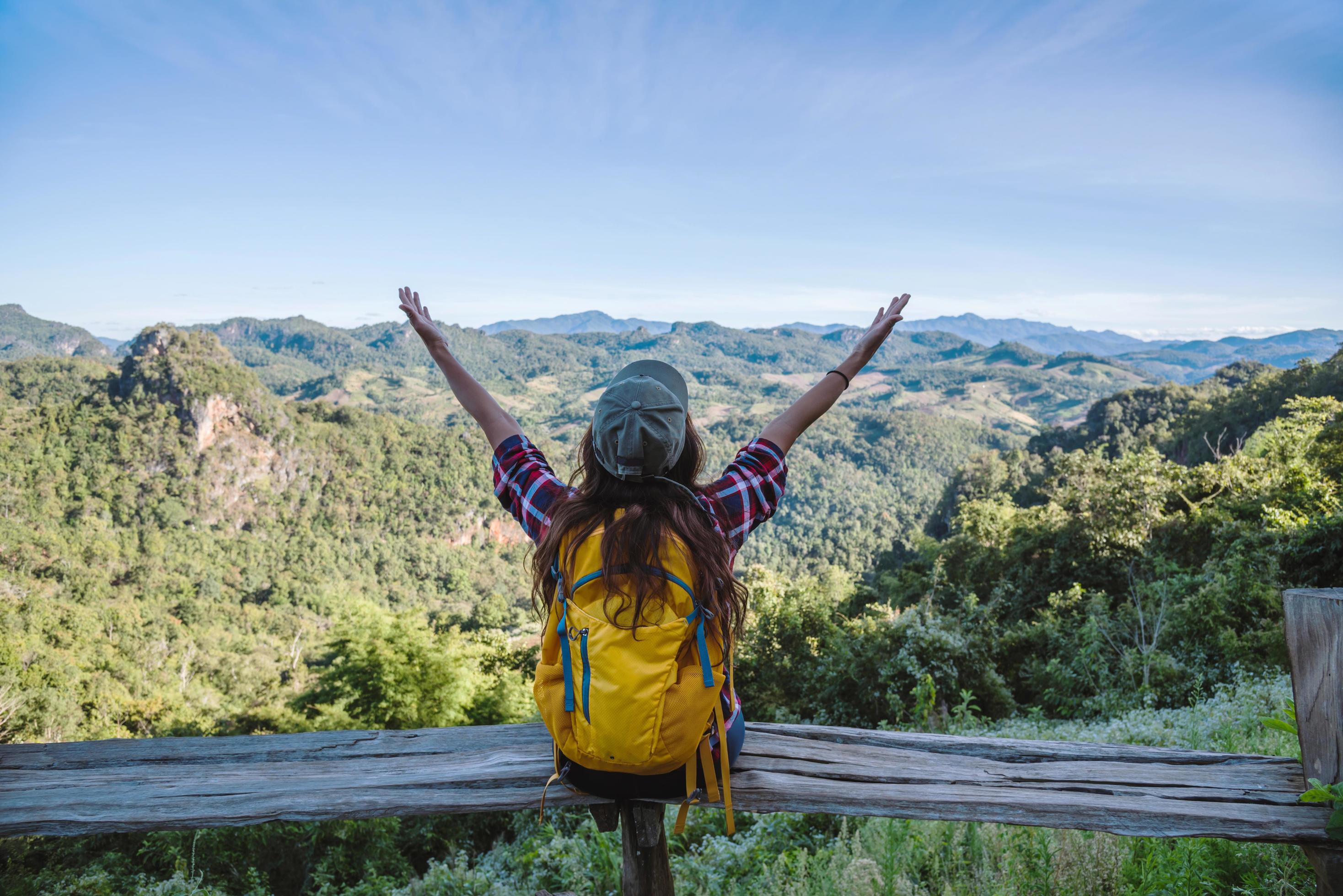 Natural travel of Asian women,While she was sitting and resting landscape view on the mountain,in Thailand Stock Free