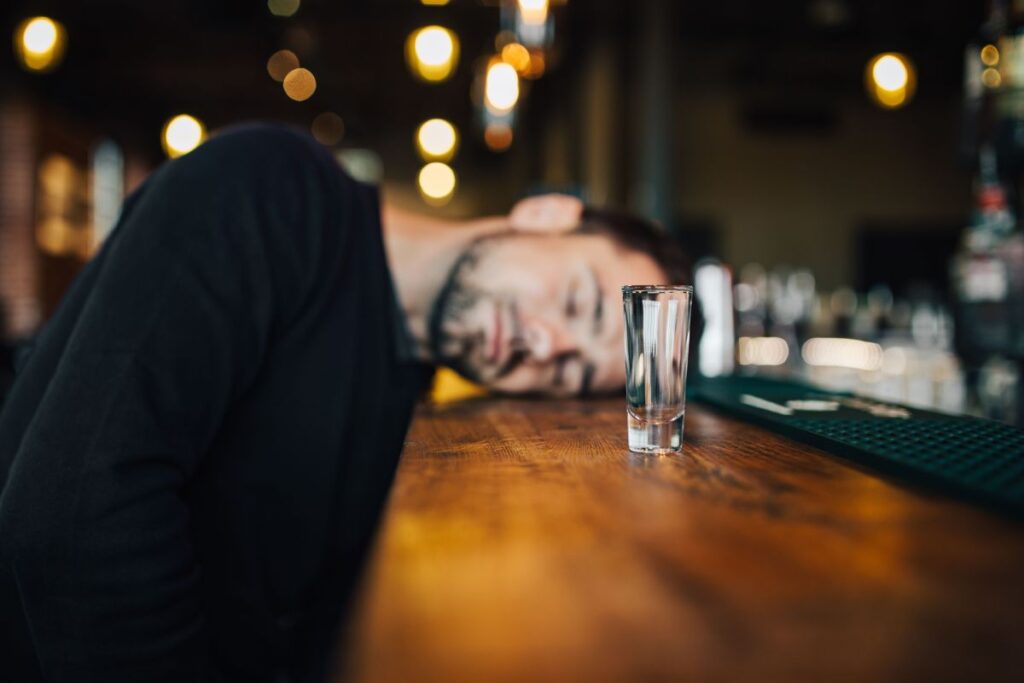 Handsome young man in a pub Stock Free