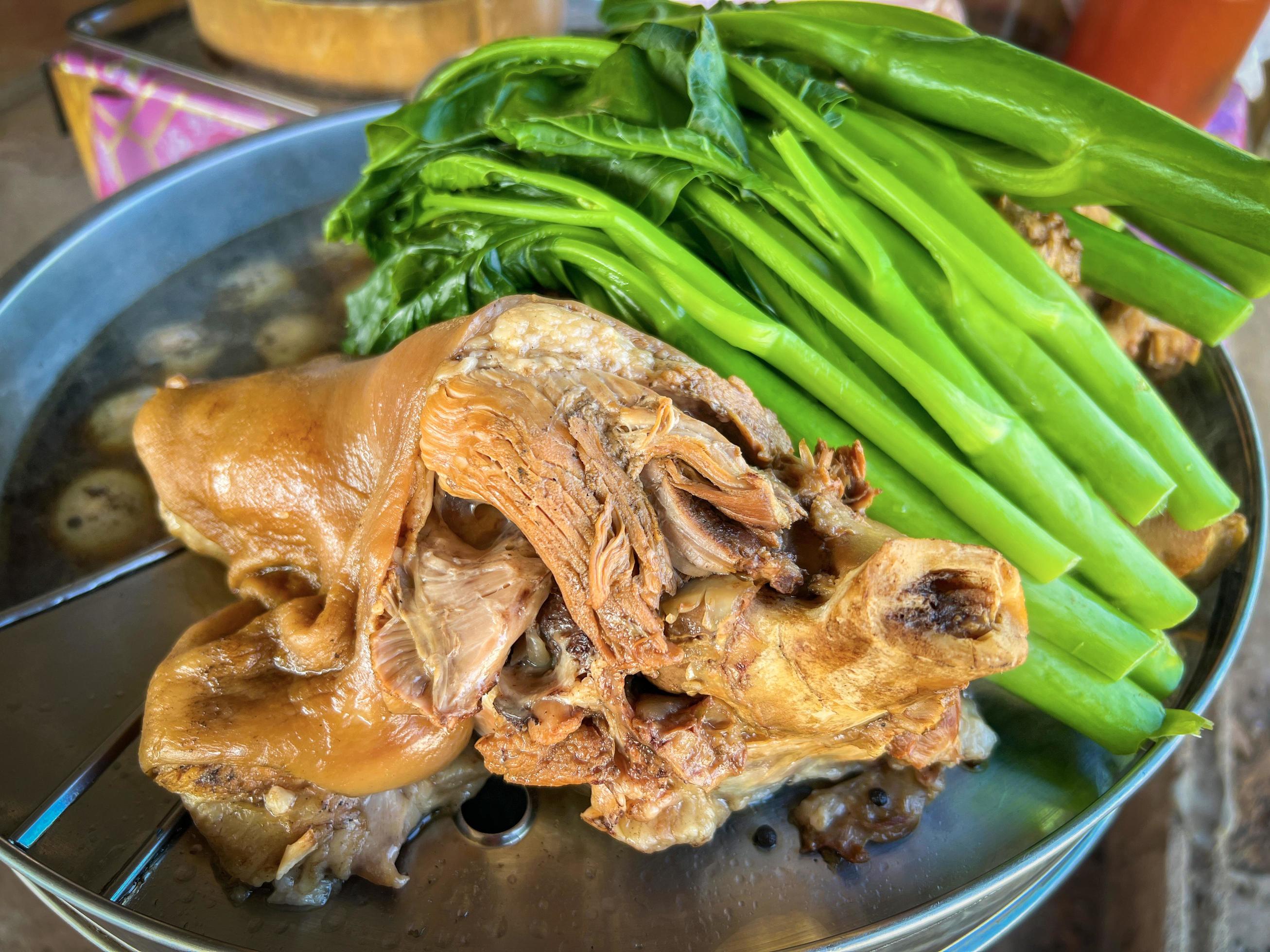 Stewed leg pork with sweet gravy sauce style chinese food or Asian Thai food stewed leg pork in the steaming pot with eggs vegetable kale Stock Free