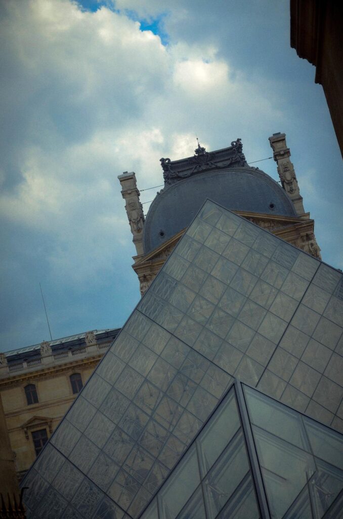 the glass pyramid of the louvre, home to the famous museum in paris, capital of france. during a hot summer day in 2012 Stock Free