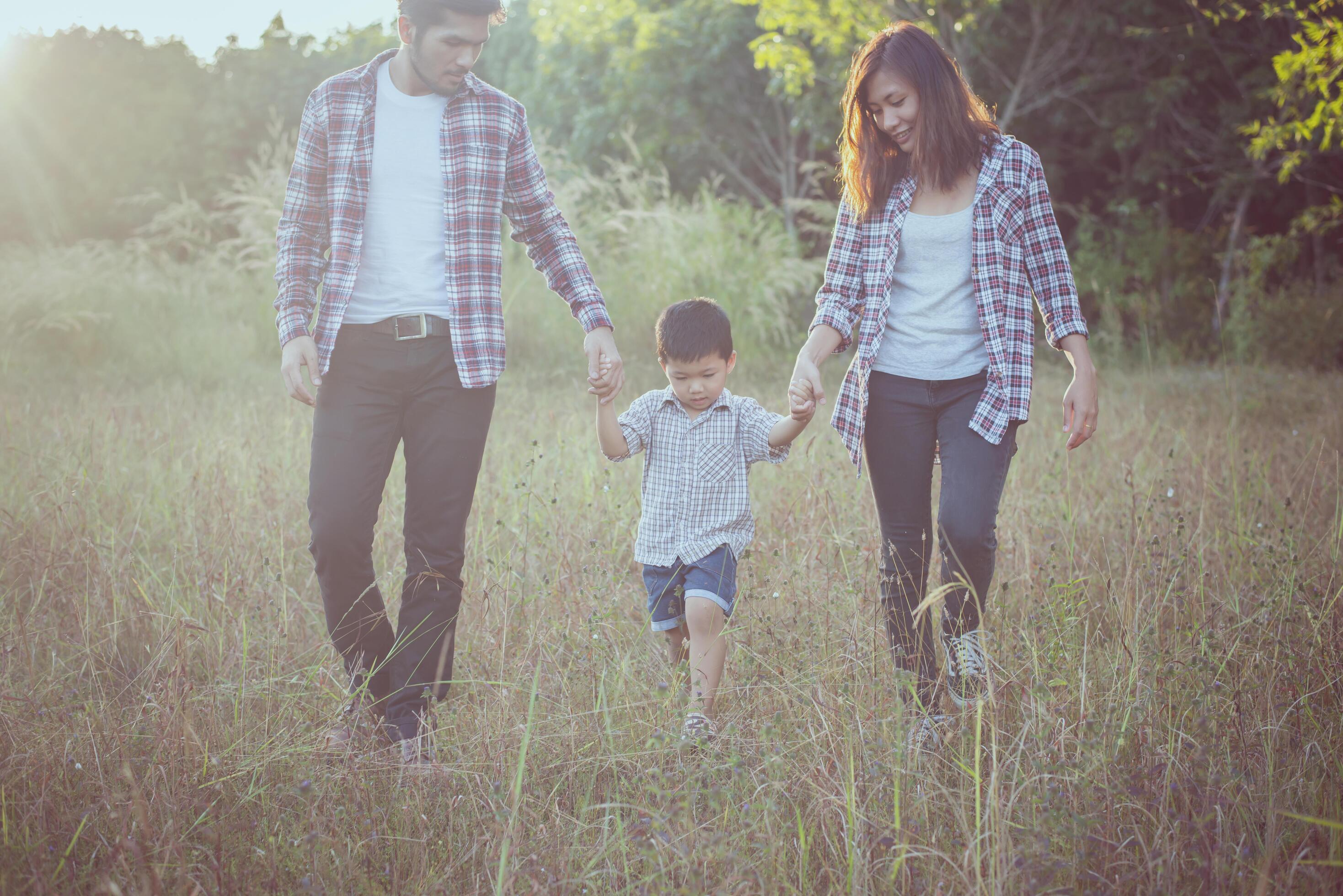 Happy young family spending time together outside. Family love concept Stock Free