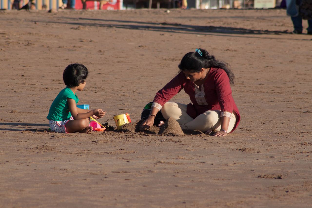 Mother Child Making Sand Castle Stock Free