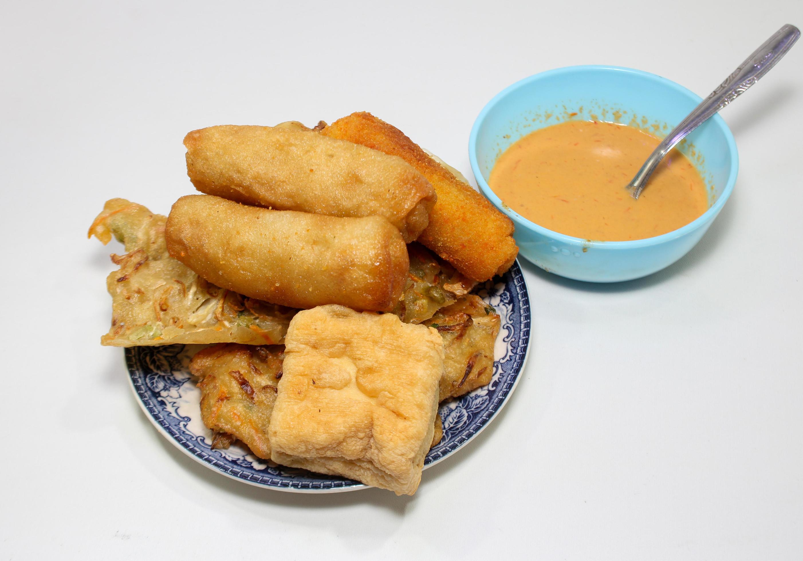 Gorengan is a typical snack from Indonesia. consisting of bakwan risol, tofu. This food is usually sold by street vendors at cheap prices. Stock Free