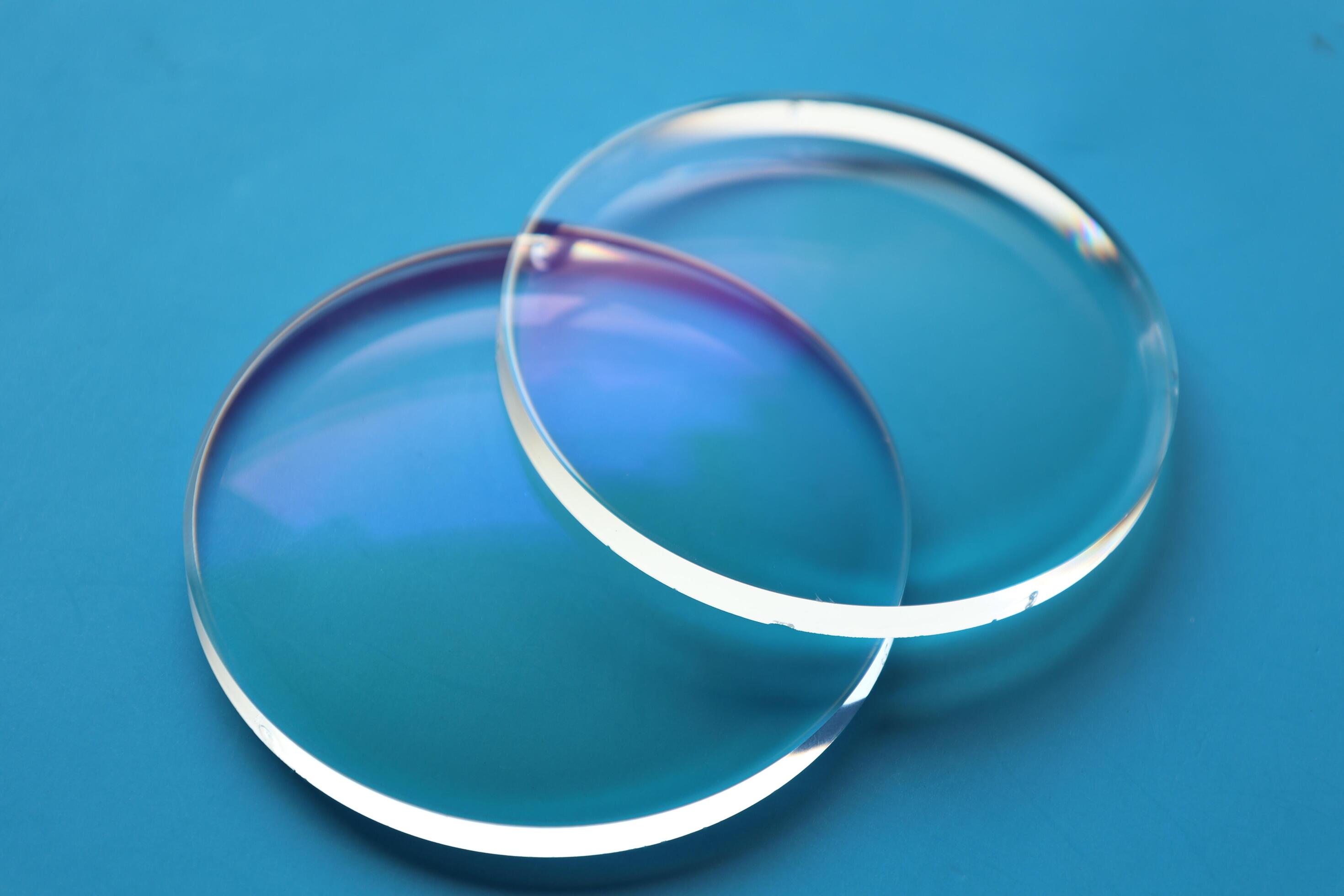 Eyeglasses lens production industry, close-up eyeglasses lenses, eyeglasses lenses, eyeglasses lenses, eyeglasses store business concept Stock Free