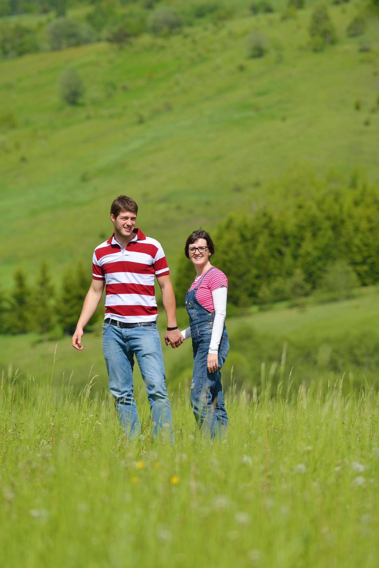 Portrait of romantic young couple smiling together outdoor Stock Free