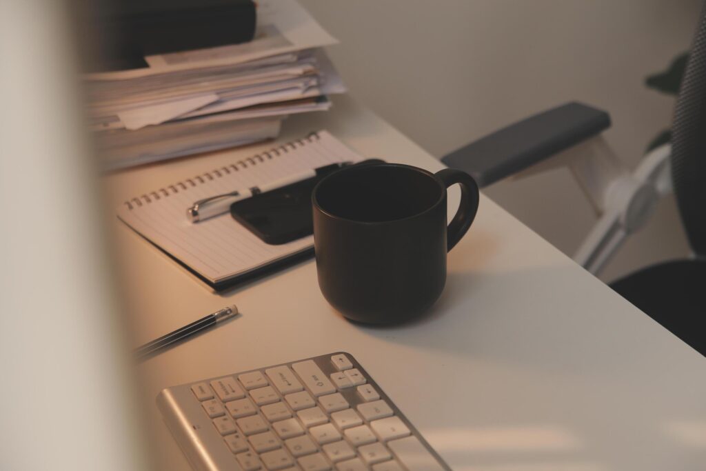 messy office workspace. Messy and cluttered office desk. Messy business office with piles of files and disorganized clutter. Stock Free