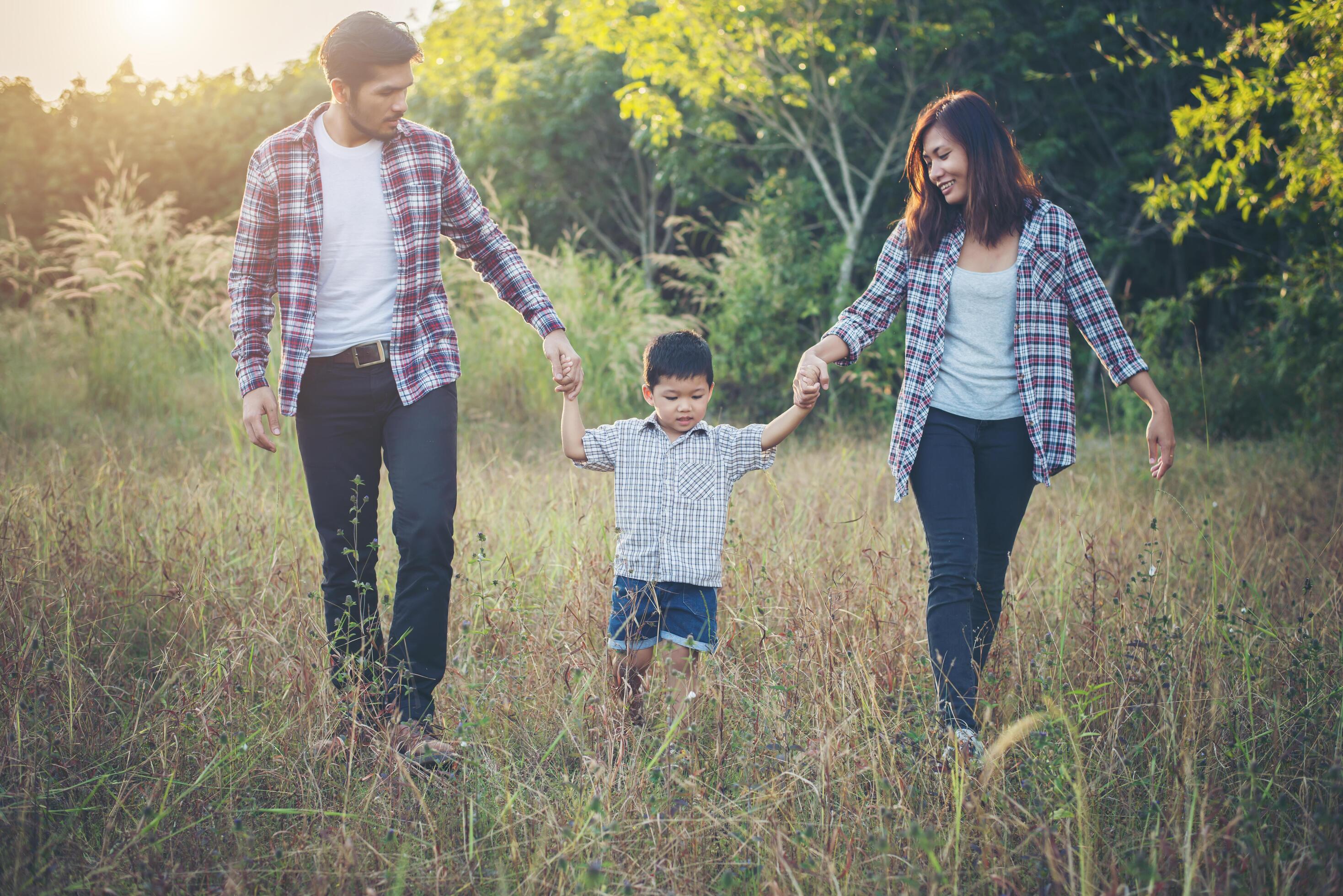 Happy young family spending time together outside. Family love concept Stock Free