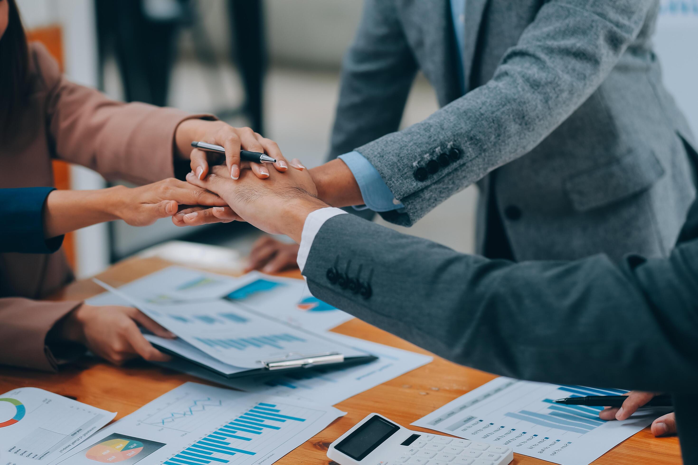 Business people join hand together during their meeting Stock Free