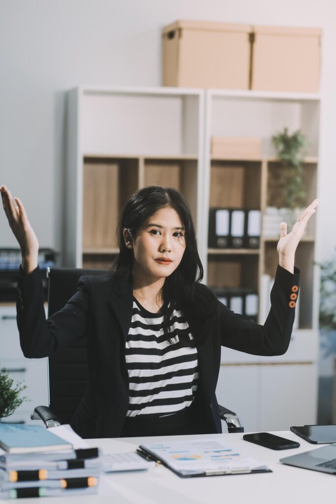 Young pretty business woman with notebook in the office Stock Free