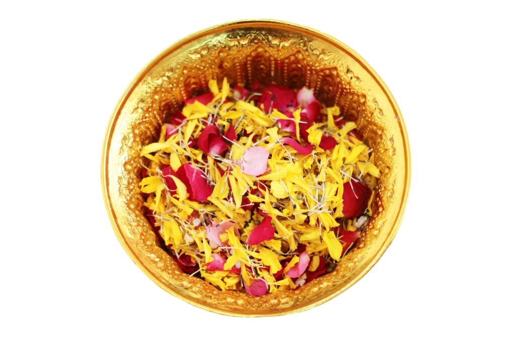 Red rose and Marigold flowers petals in gold tray isolated on white background in tradition Thai wedding ceremony and Buddhism in the temple Stock Free