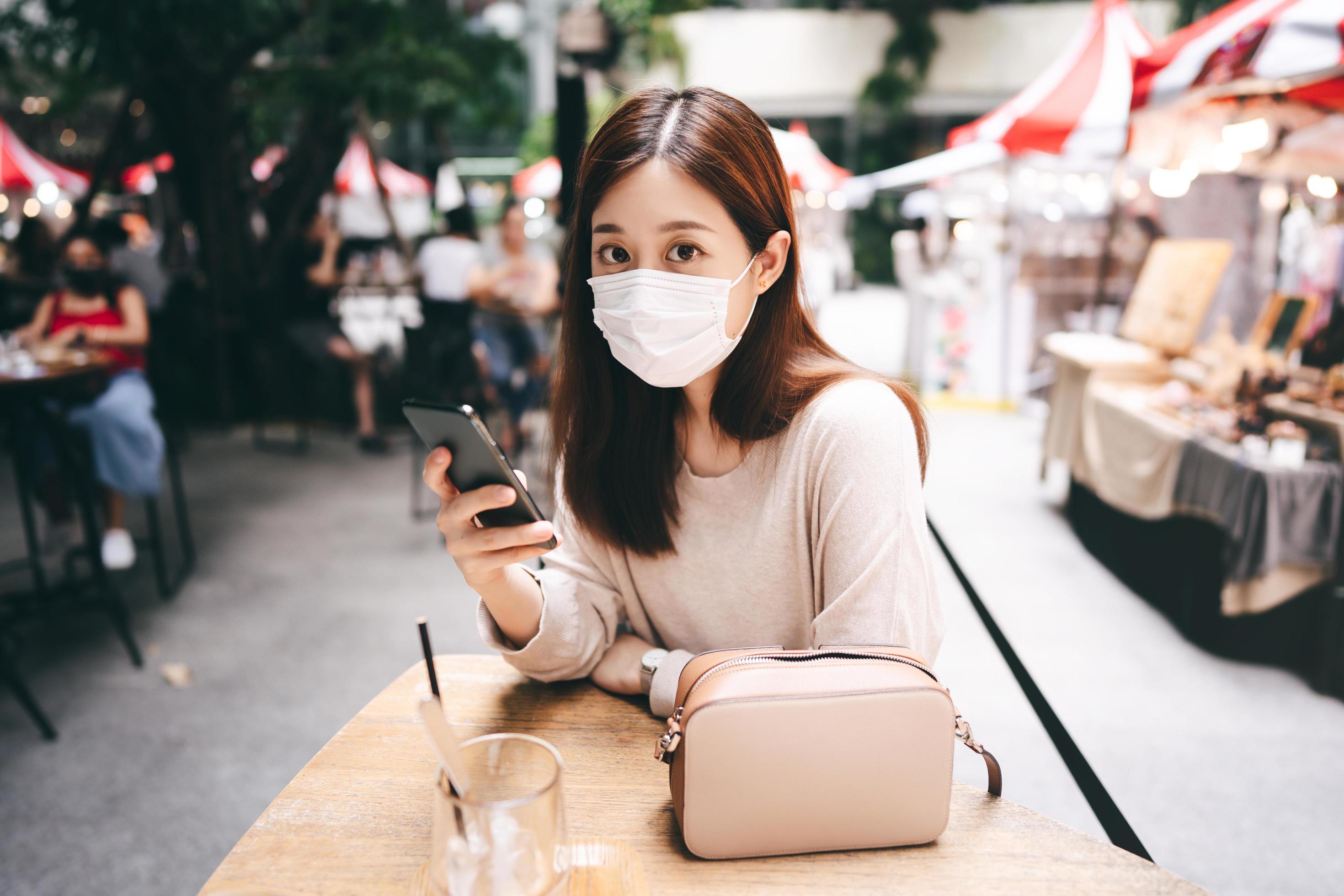 Young adult asian woman wear mask for new normal lifestyle protect from corona virus Stock Free