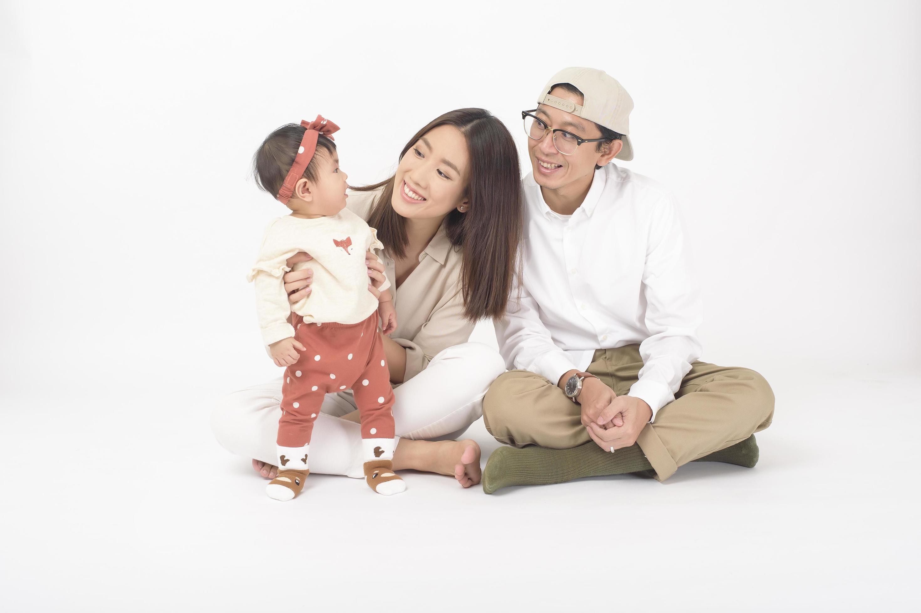 Happy Asian family on white background Stock Free