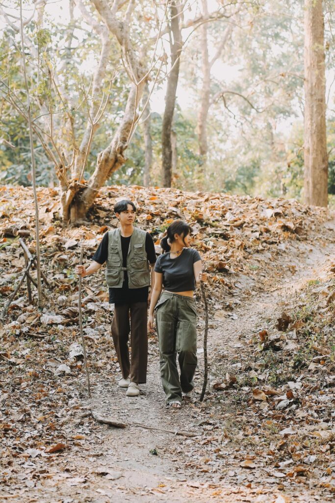 Asian couple sweet in tent inside on they camping trip, traveller relax and sleep togather in out door and camping trip Stock Free