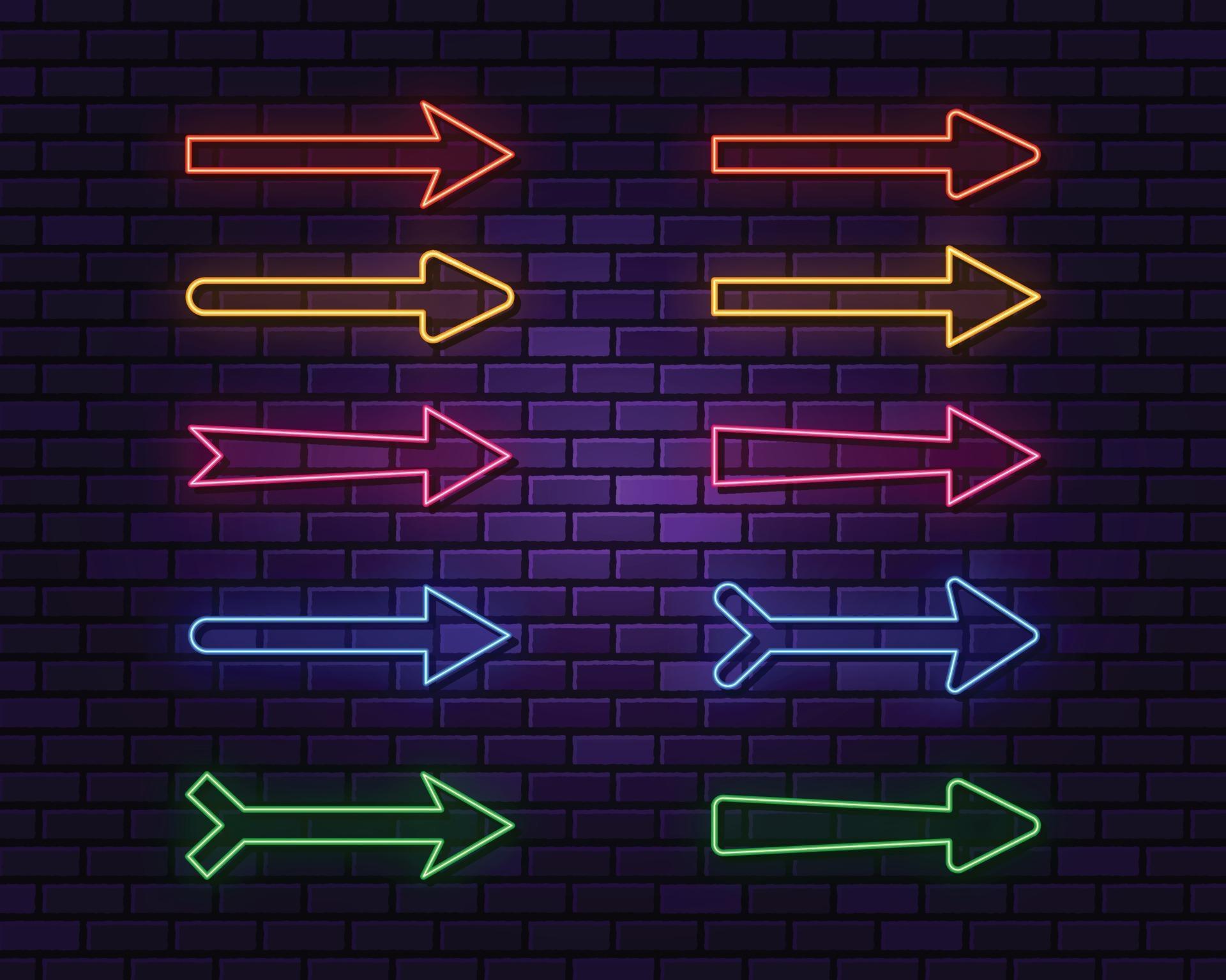 Neon arrows collection on dark background Stock Free