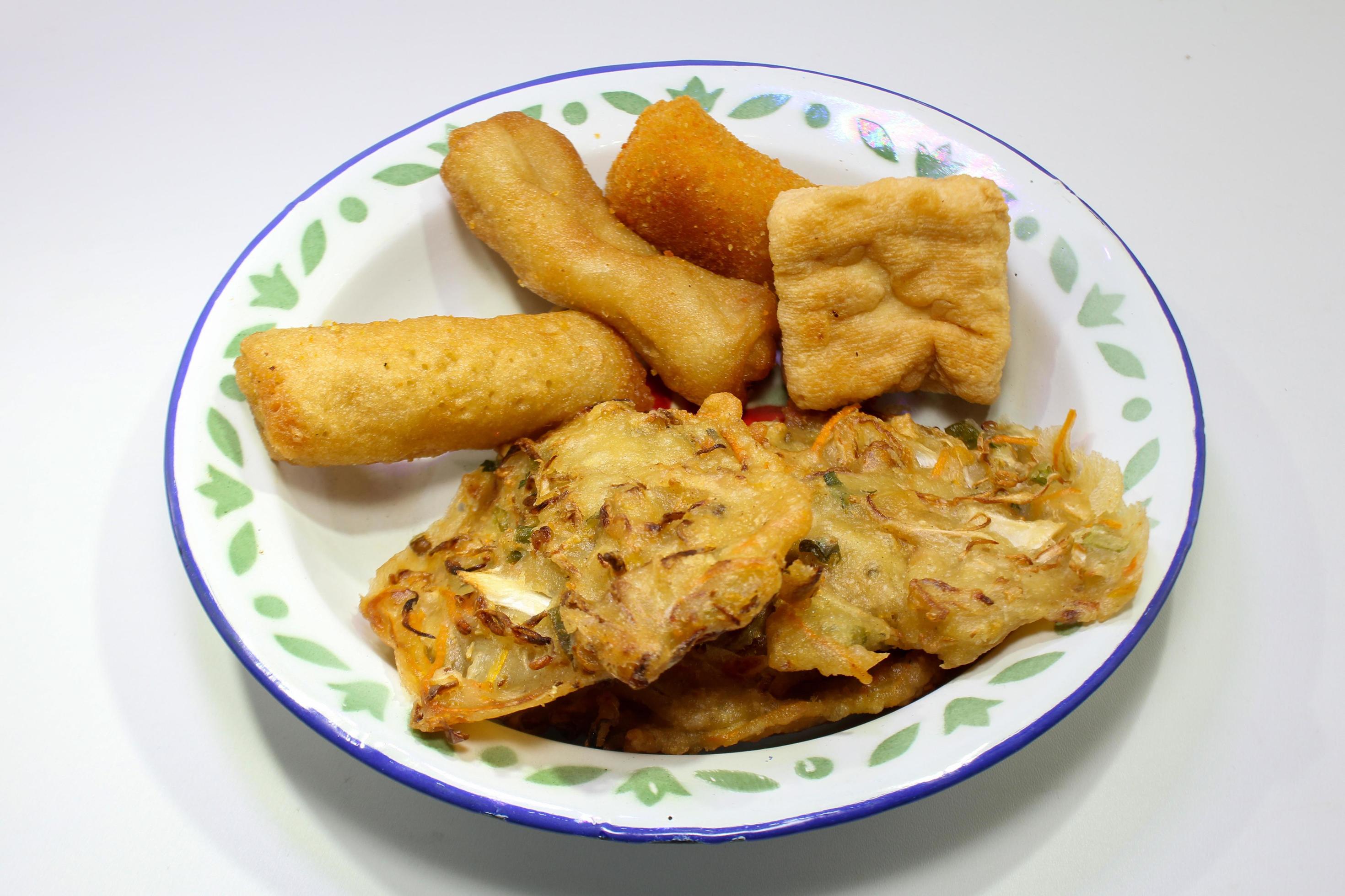 Gorengan is a typical snack from Indonesia. consisting of bakwan risol, tofu. This food is usually sold by street vendors at cheap prices. Stock Free