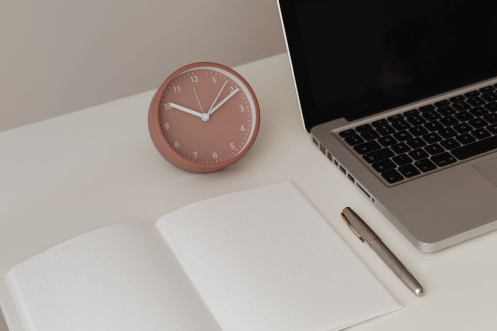 Detail of desk with laptop – supplies – notepad Stock Free