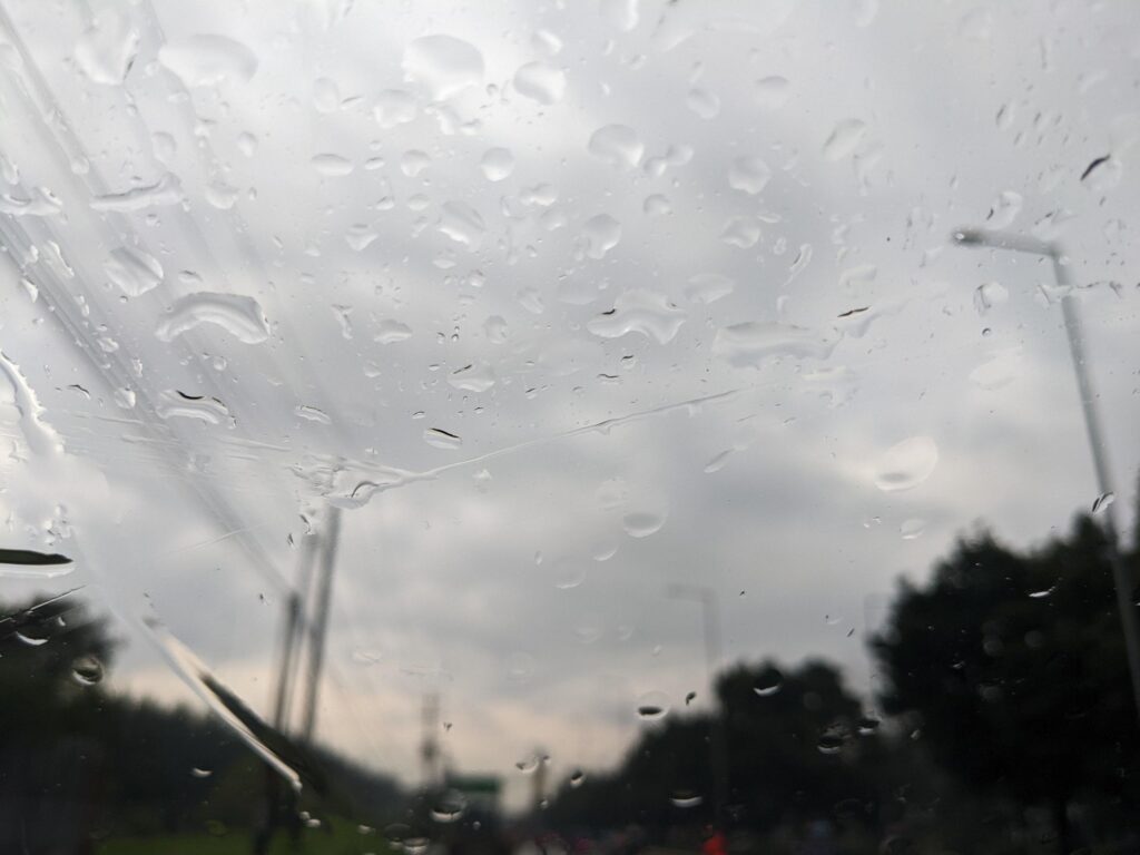 Drop water on the front glass cover of the car. The photo is suitable to use for nature background and nature content media. Stock Free