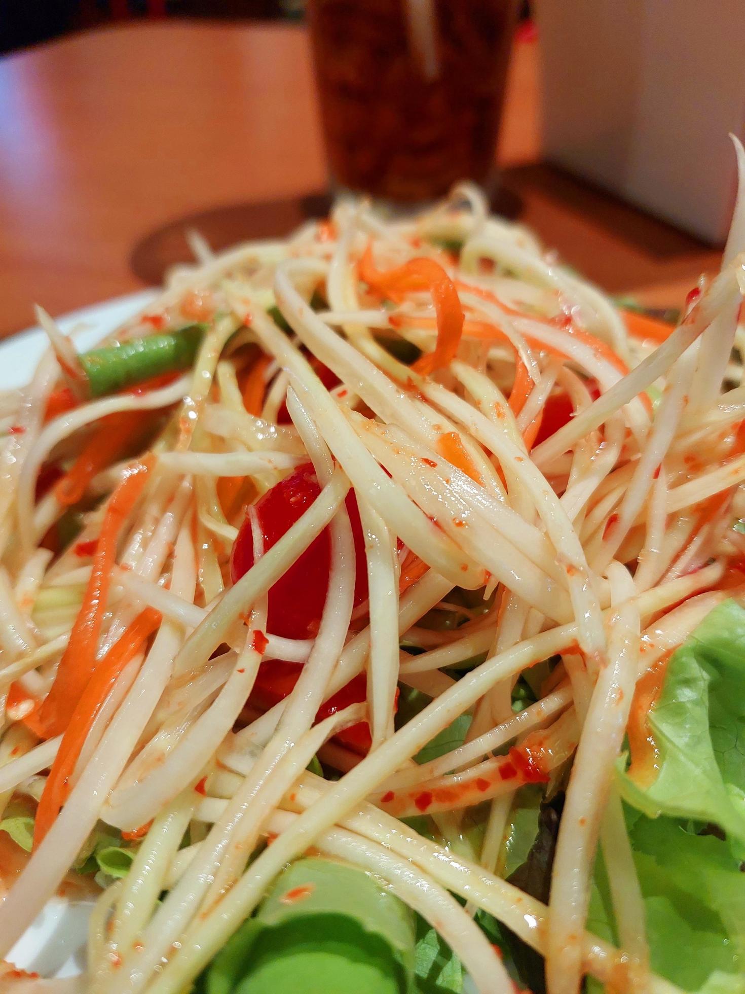 Traditional Thai food papaya salad prepared with fine slices of papaya, tomatoes, green beans and peanuts, Somtum from Thailand Stock Free