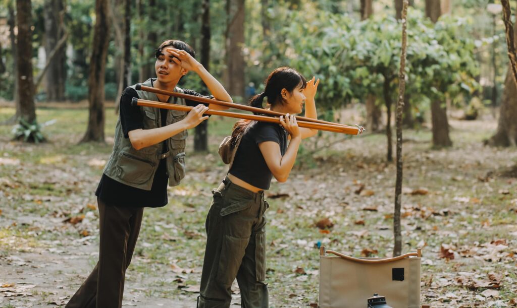 Asian couple sweet in tent inside on they camping trip, traveller relax and sleep togather in out door and camping trip Stock Free