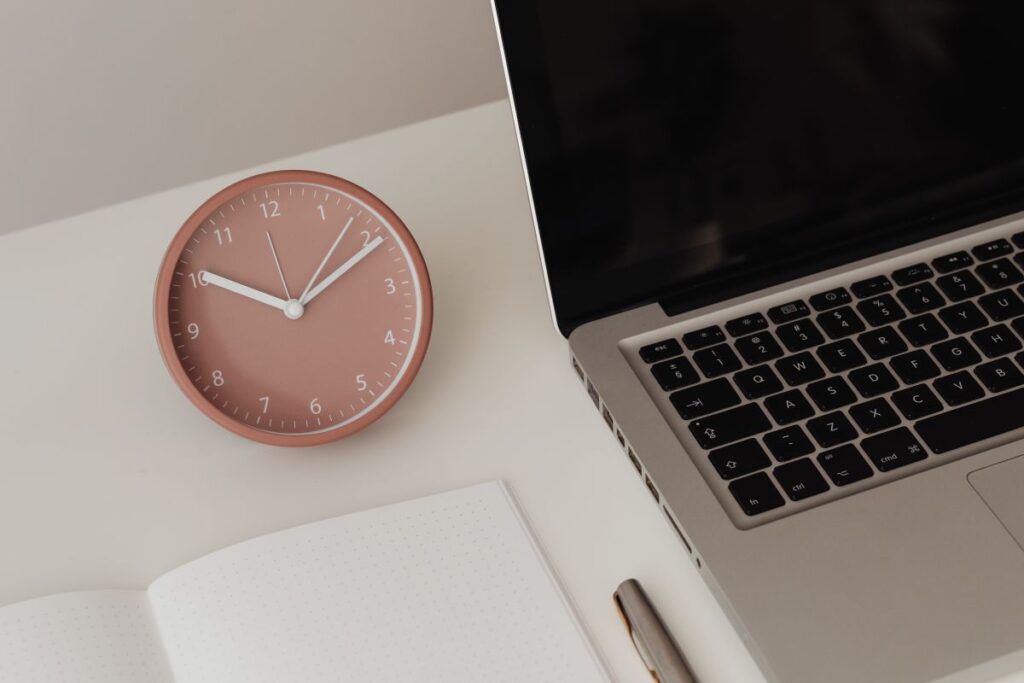 Detail of desk with laptop – supplies – notepad Stock Free