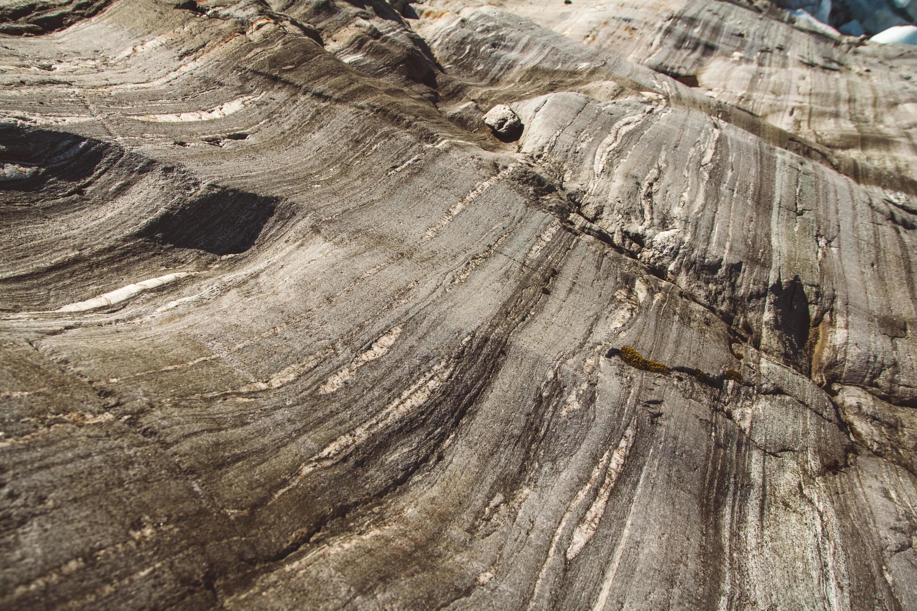 Stone texture from waves erode, nature background. Top view. Copy space. Can use as banner Stock Free