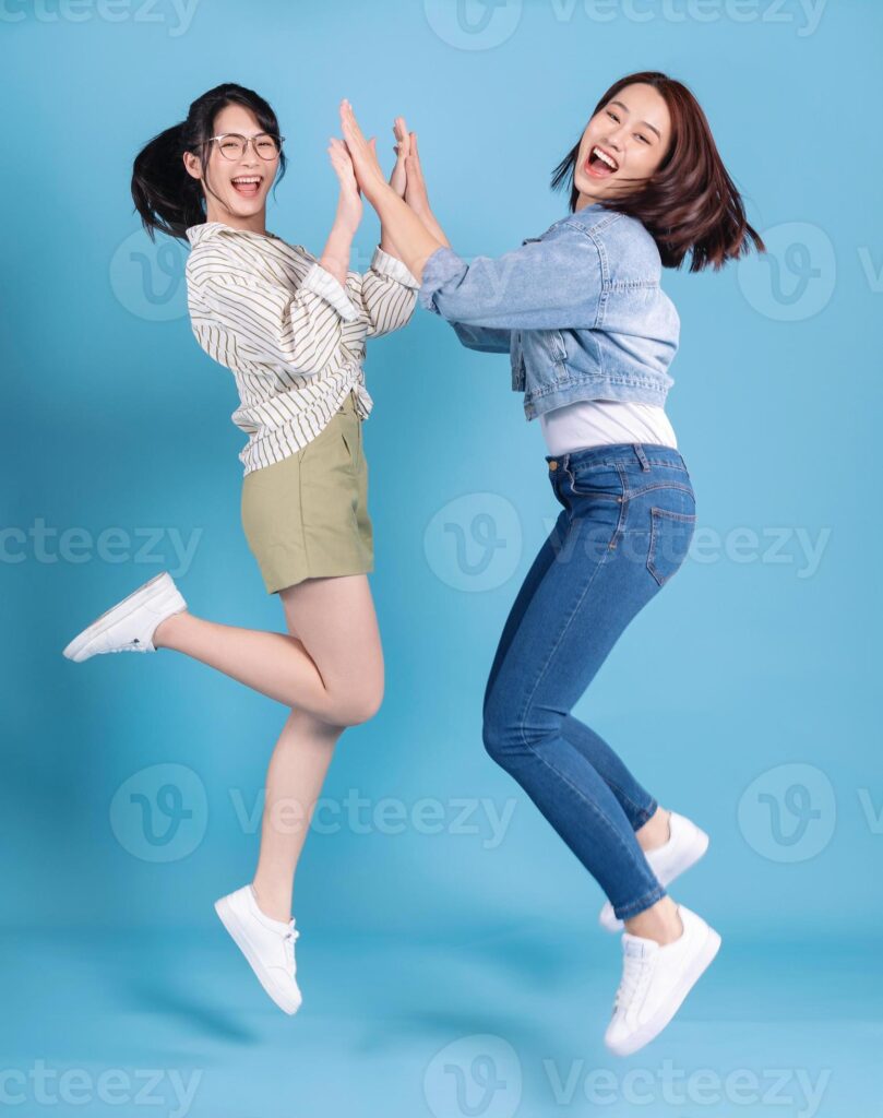 Two women on blue background Pro Photo