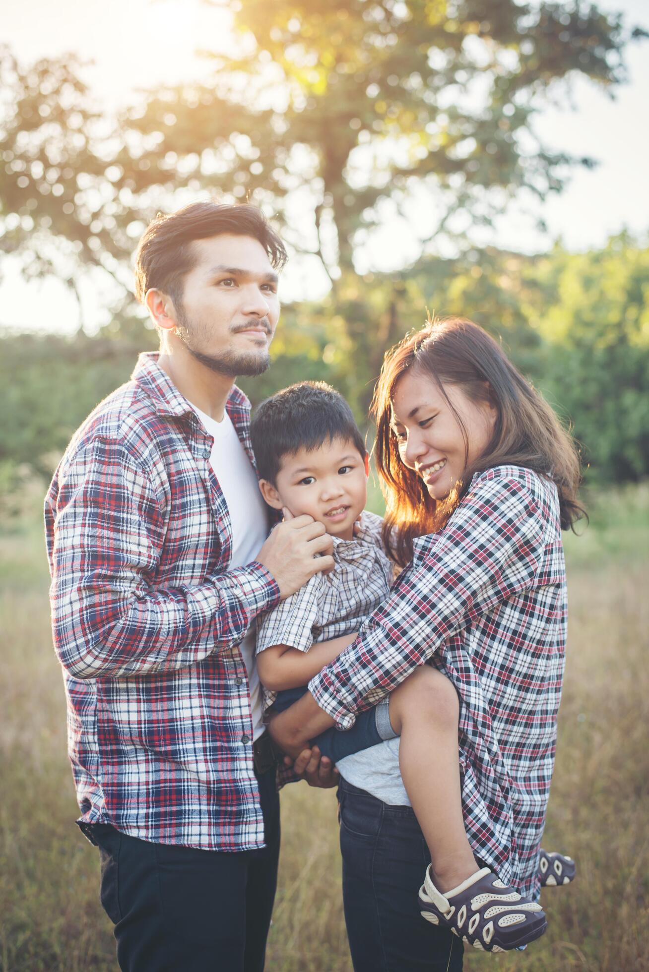 Happy young family spending time together outside. Family love concept Stock Free