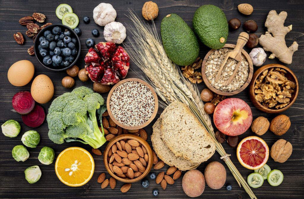 Top view of healthy foods on a dark wood background Stock Free