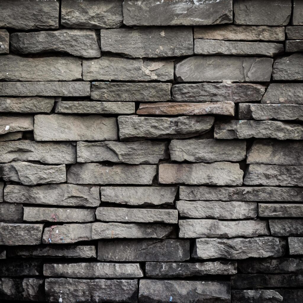 old black brick wall background and texture Stock Free