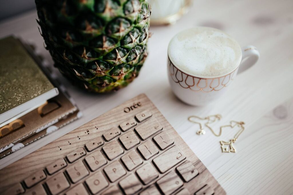 Wooden keyboard and cup of coffee Stock Free