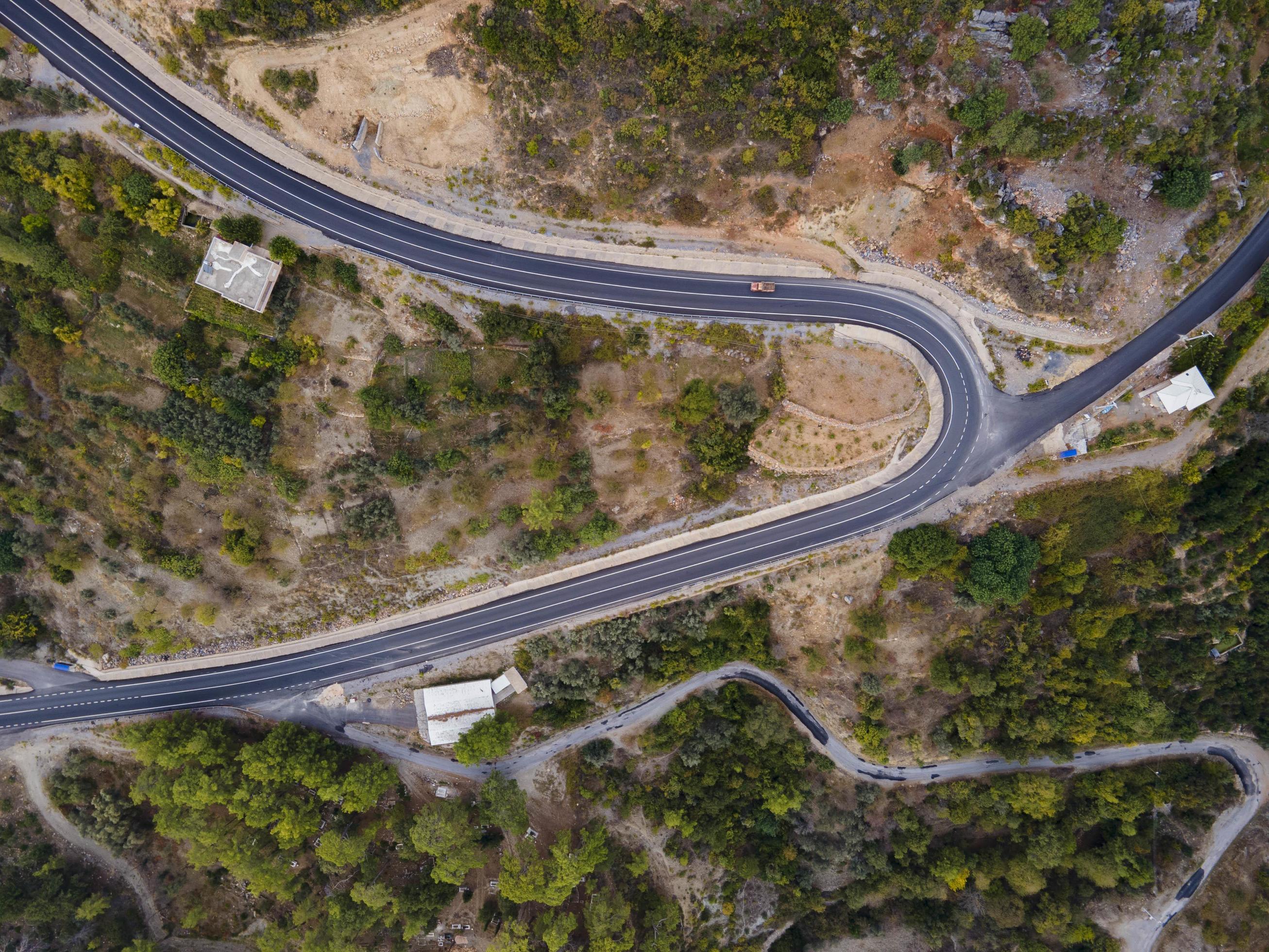 aerial valley and road, Top view, amazing nature background. sunset Flying drone, seascape Stock Free