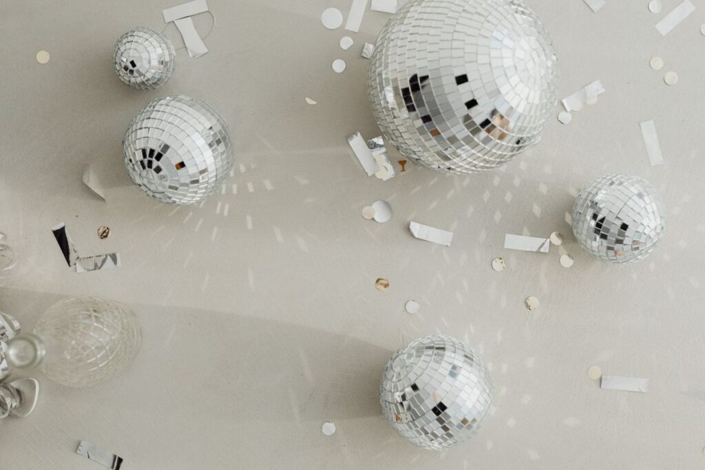 New Year’s Eve party mess – confetti – disco balls Stock Free