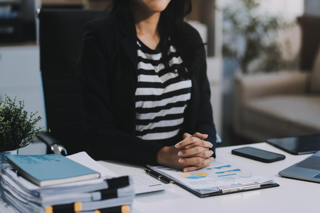 Young pretty business woman with notebook in the office Stock Free