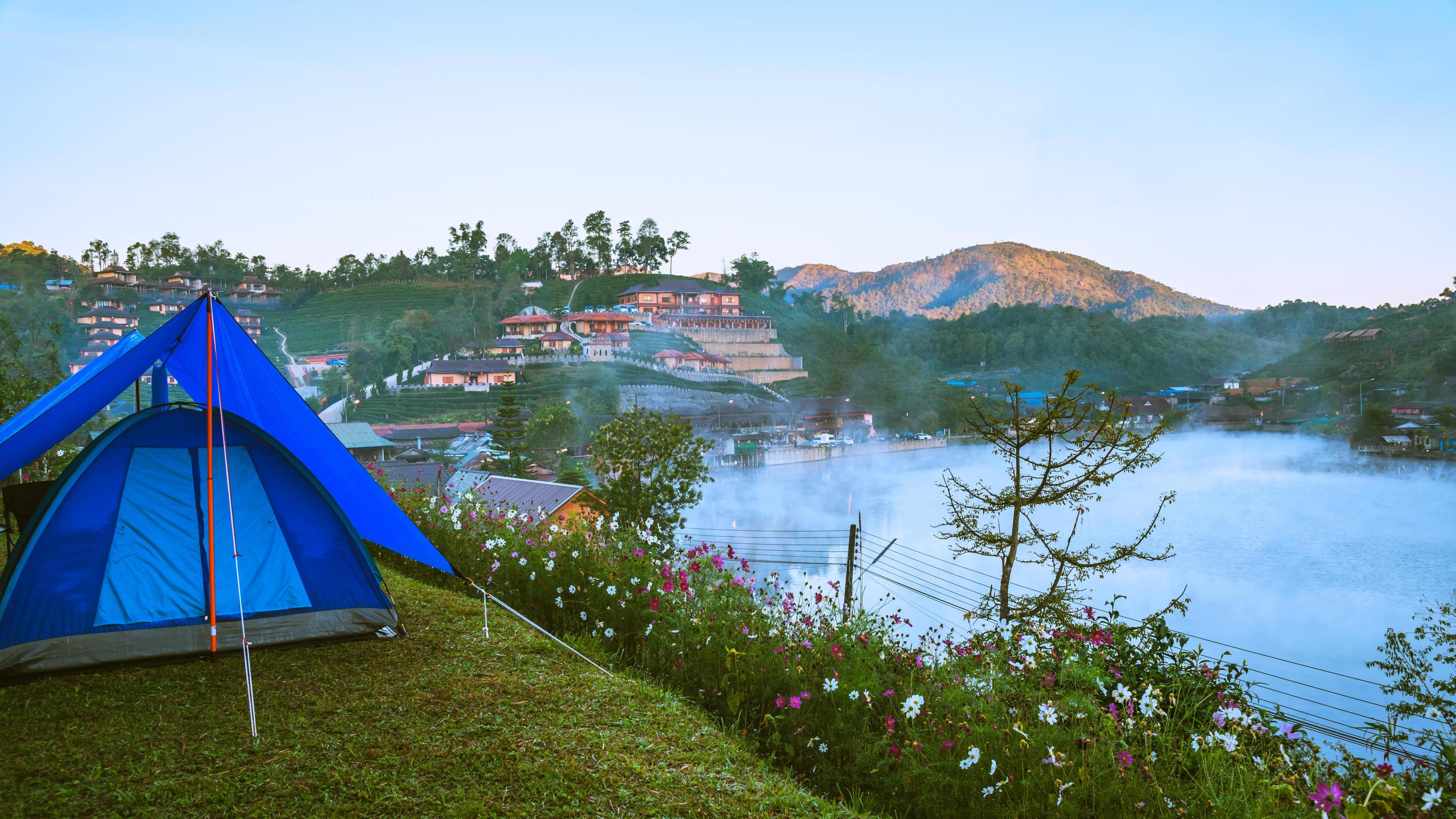 The concept of setting up a mountain camp, Camping Tent, Travel relax. Landscapes, nature, fog touch at Thailand. Stock Free