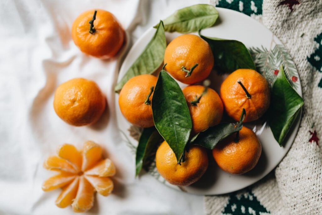 Still life of mandarin oranges with leaves Stock Free