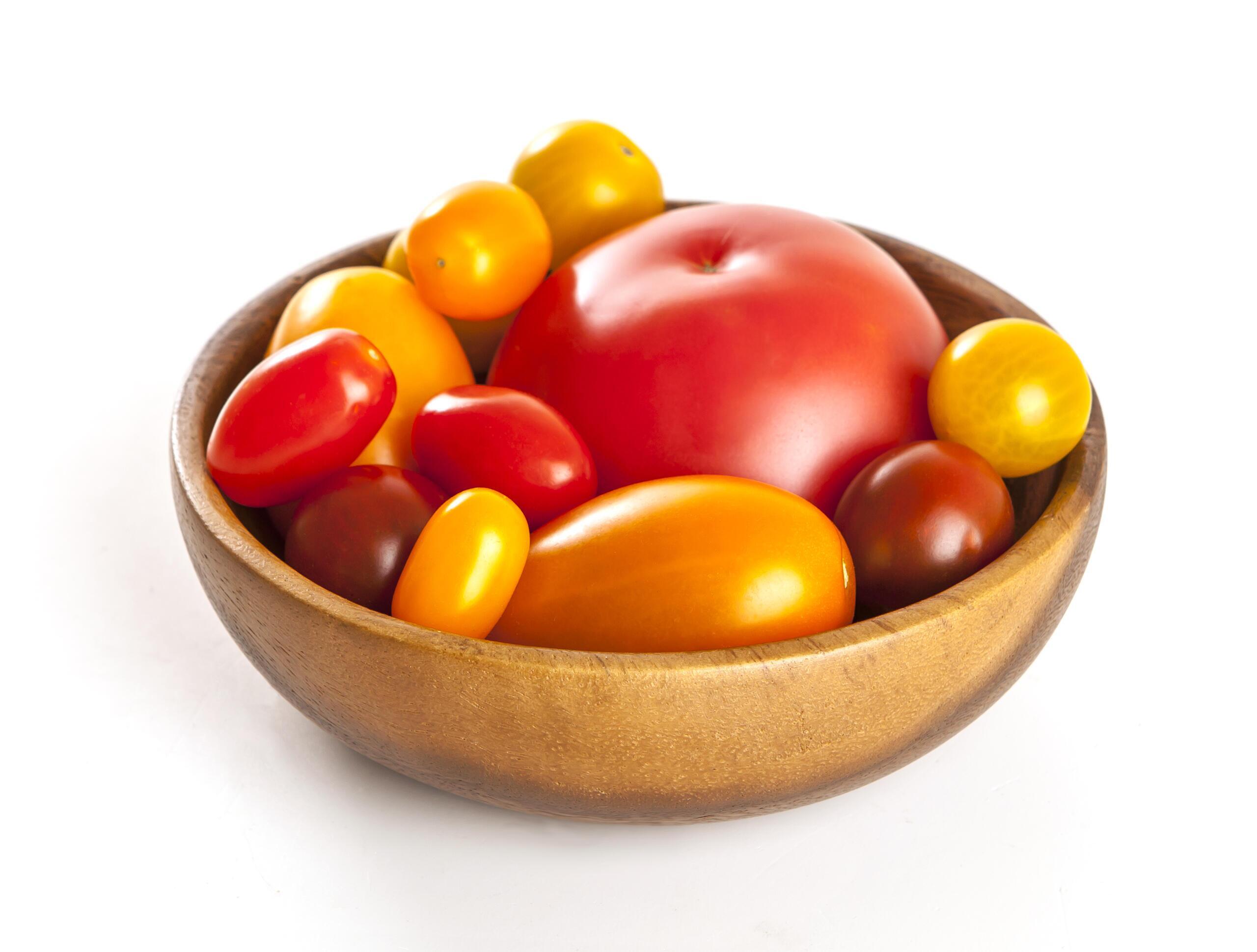 Variety of tomatoes isolated, multicolored tomatoes isolated on white background. Stock Free