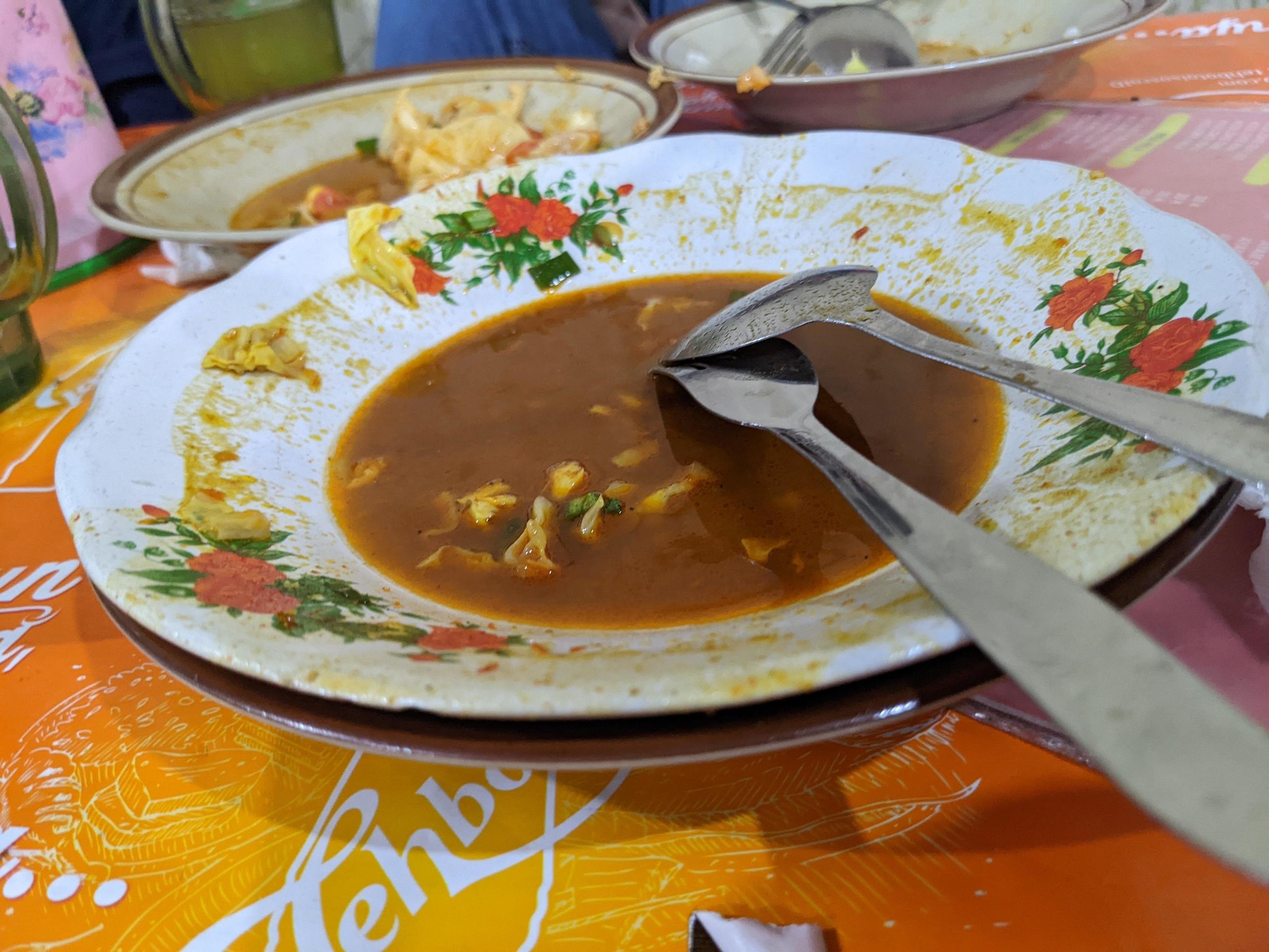 Plate and bowl after finish dinner on the traditional restaurant. The photo is suitable to use for food background, poster and food content media. Stock Free