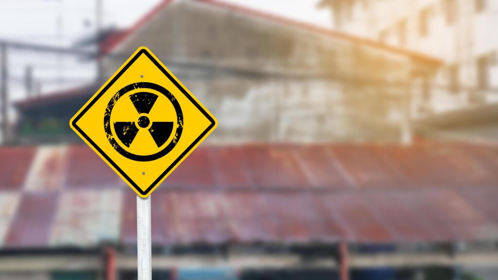 
									Yellow radioactive sign on blur background Stock Free