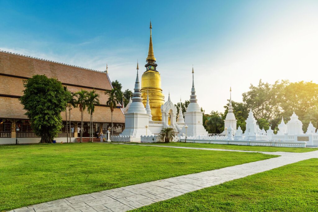 The golden pagoda at Wat Suan Dok, Chiangmai, Thailand, with beautiful blue sky. Stock Free