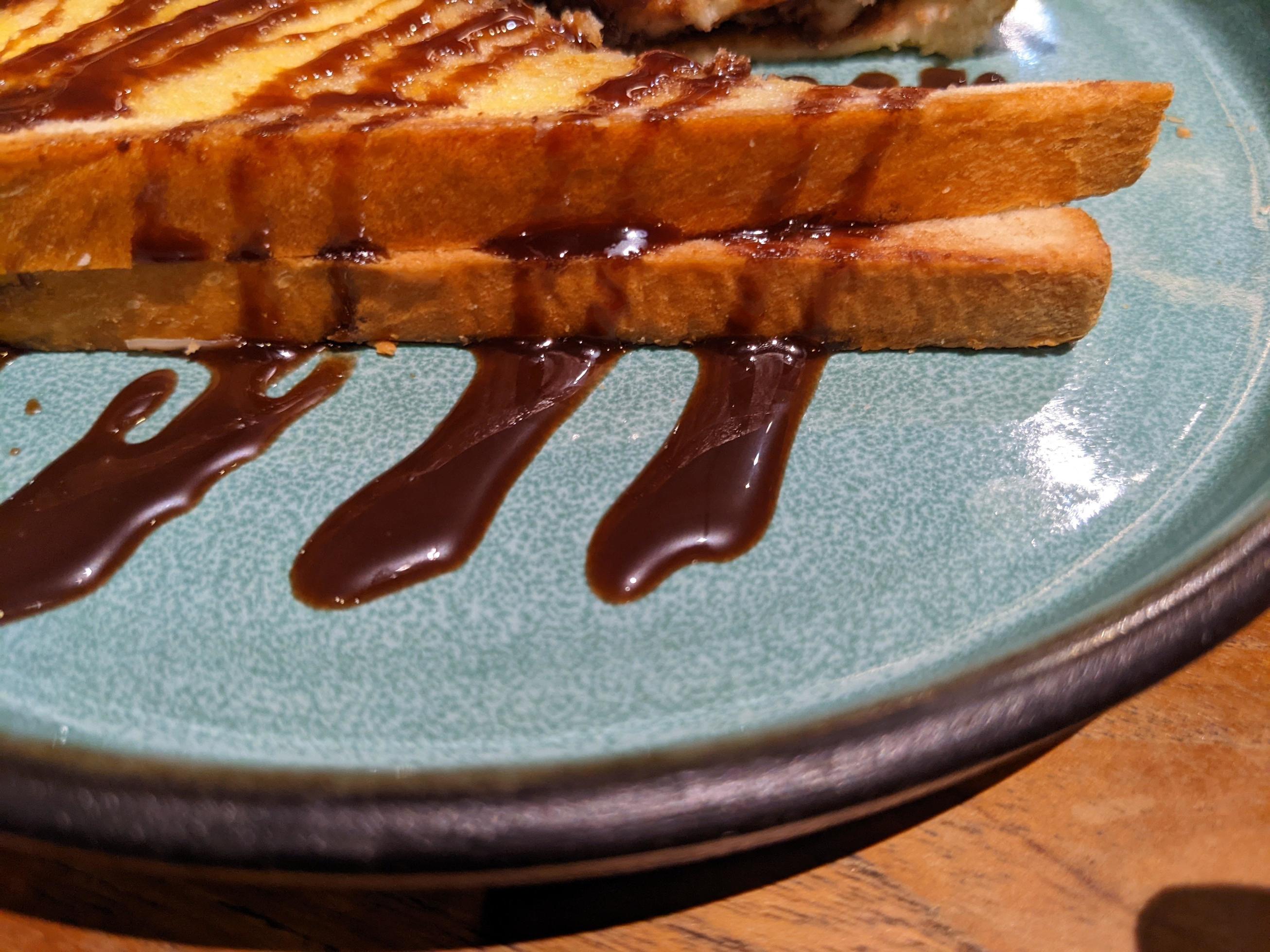 Close up photo of roasted bread with brown sugar and chocolate jam. The photo is suitable to use for food background, poster and food content media. Stock Free