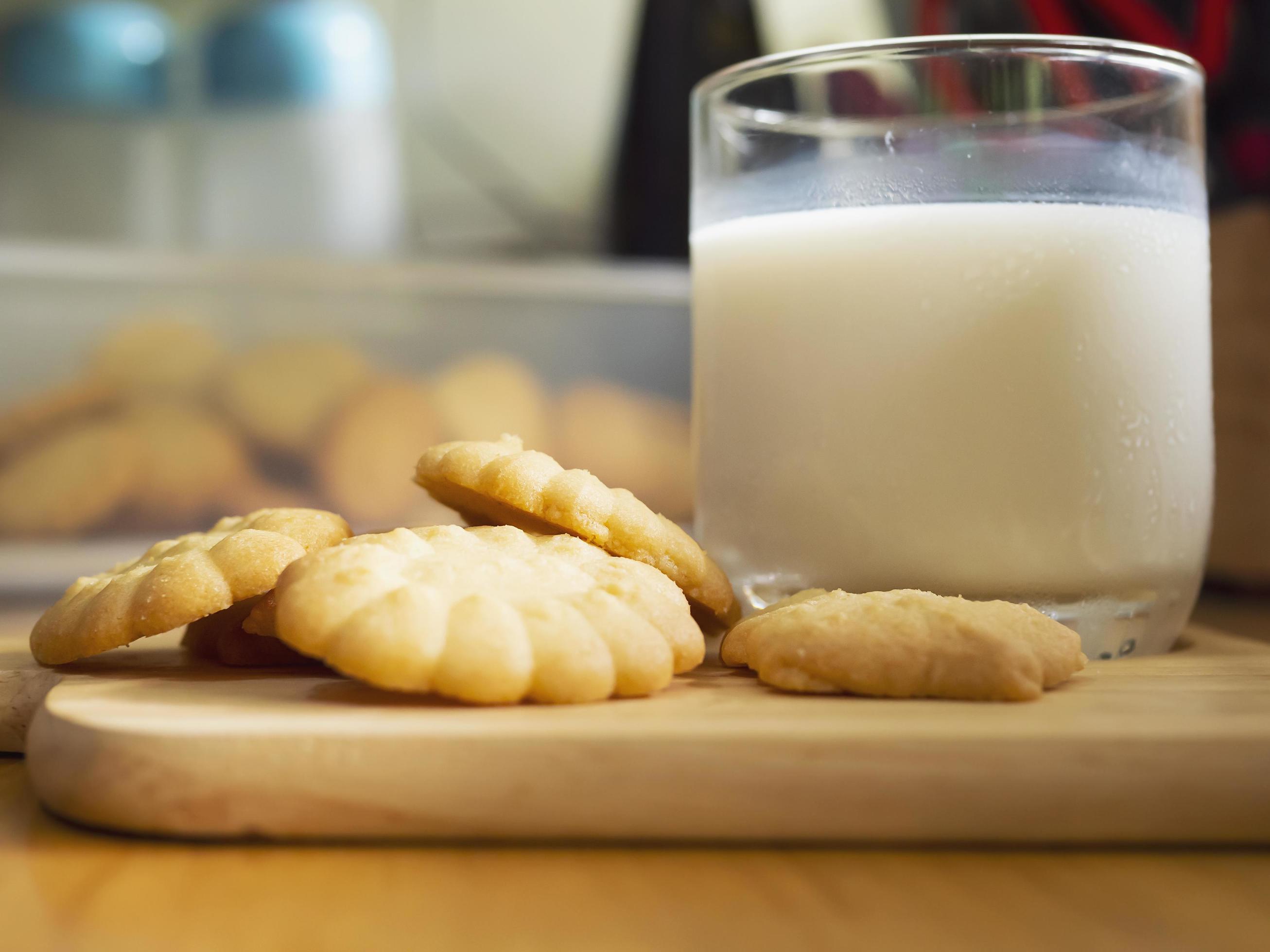 butter cookies with milk ready for serve, crispy chip snack dairy freshness bakery photography for food sweet dessert background use Stock Free