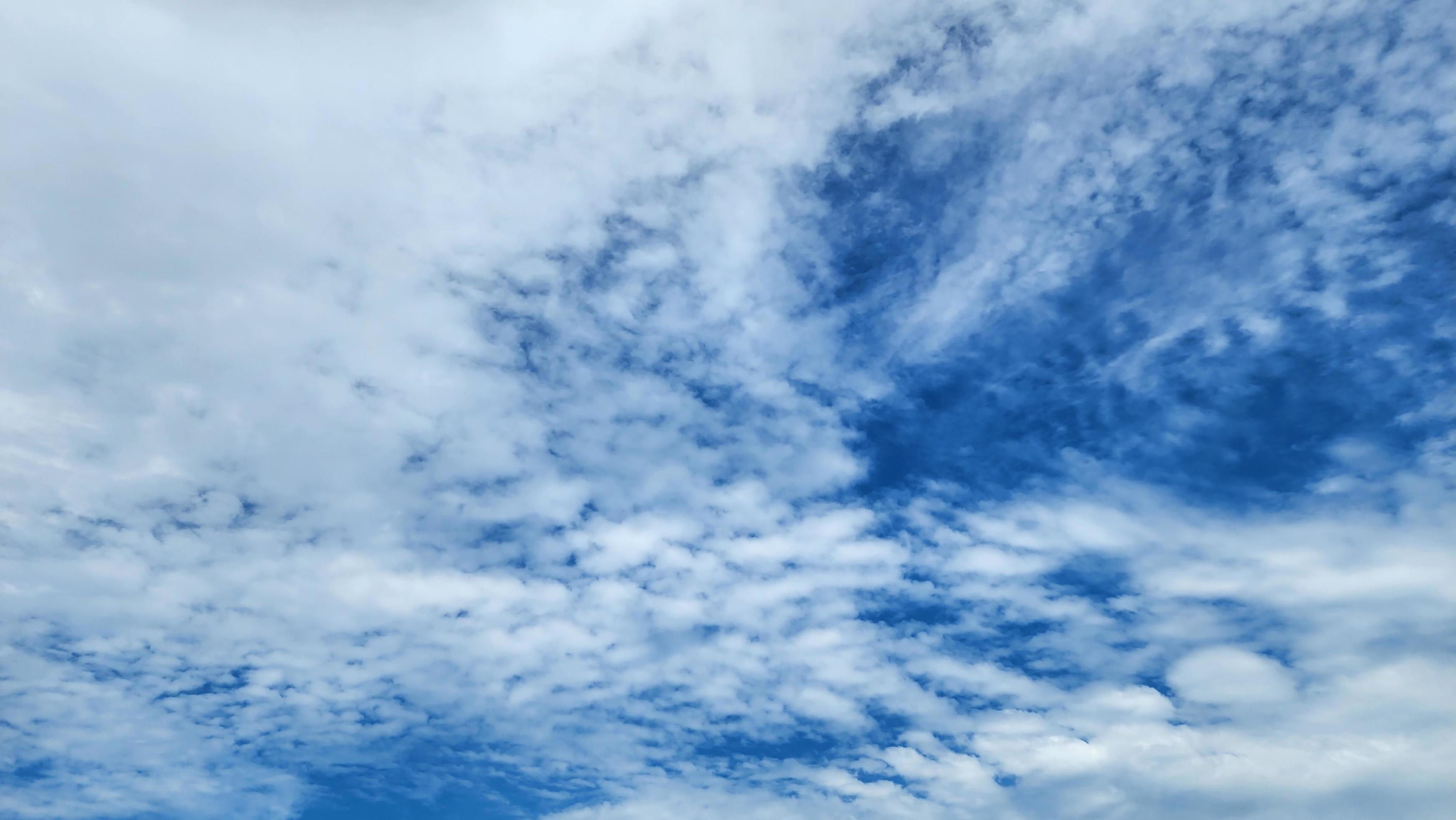 Cumulus Clouds In A Blue Sky During Day Time. Natural Sky Background and Wallpaper Stock Free