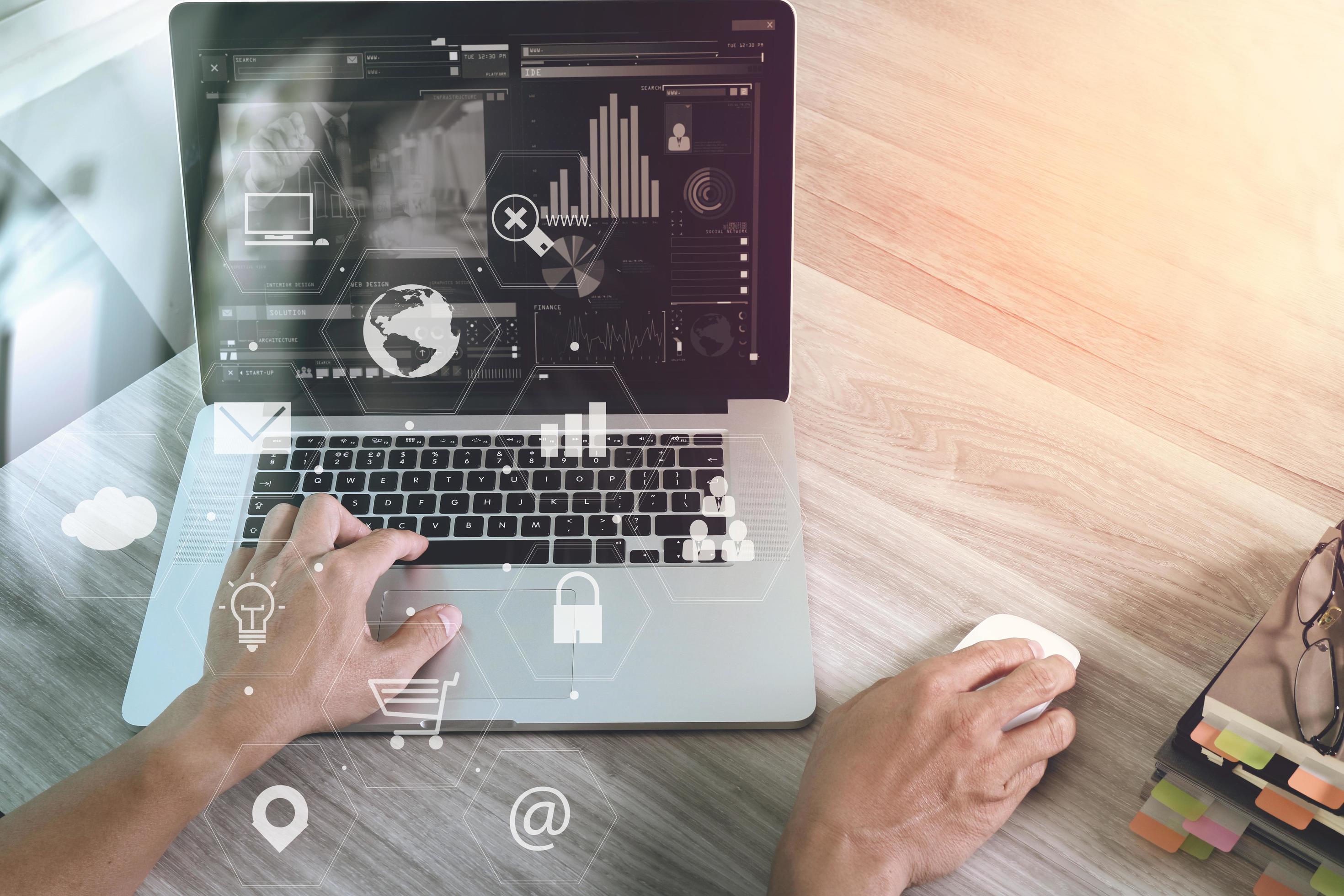 businessman working with laptop computer and digital tablet and book and document on wooden desk in modern office with virtual icons interface Stock Free