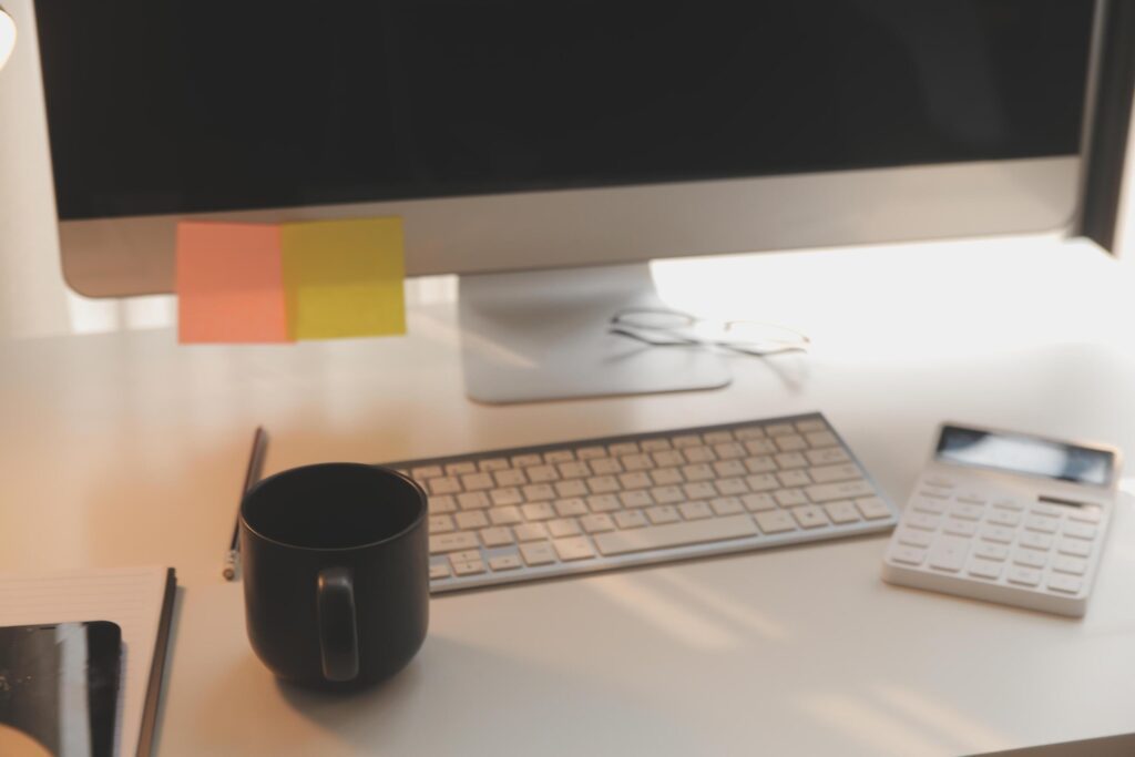 messy office workspace. Messy and cluttered office desk. Messy business office with piles of files and disorganized clutter. Stock Free