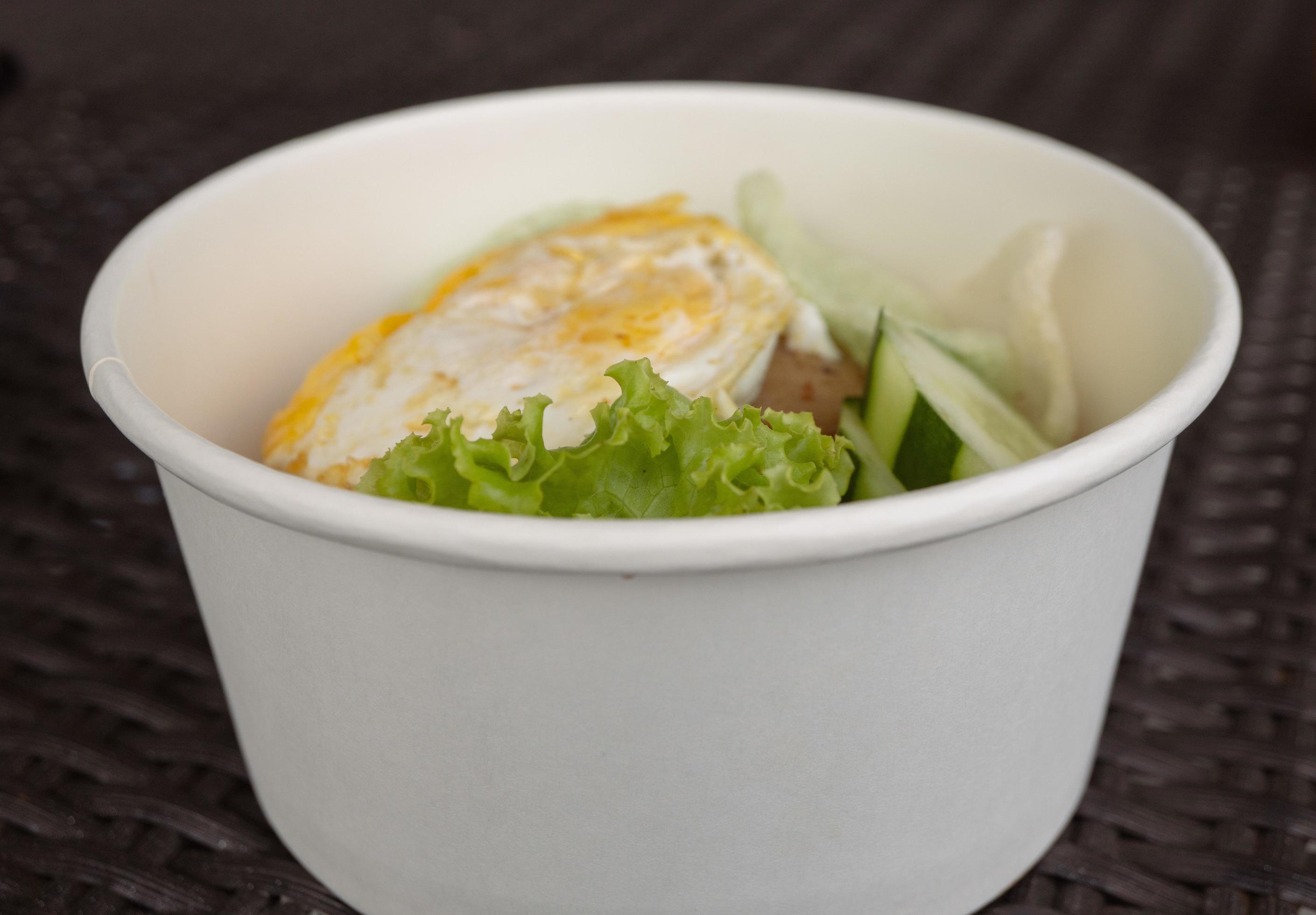 Close up photo fried rice with eggs and lettuce. The photo is suitable to use for traditional food background, poster and food content media. Stock Free