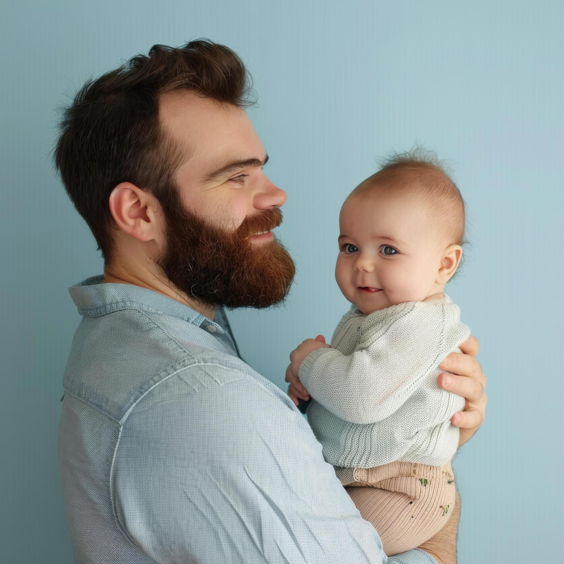 Father holding a baby with affection suitable for family or parenting content Stock Free