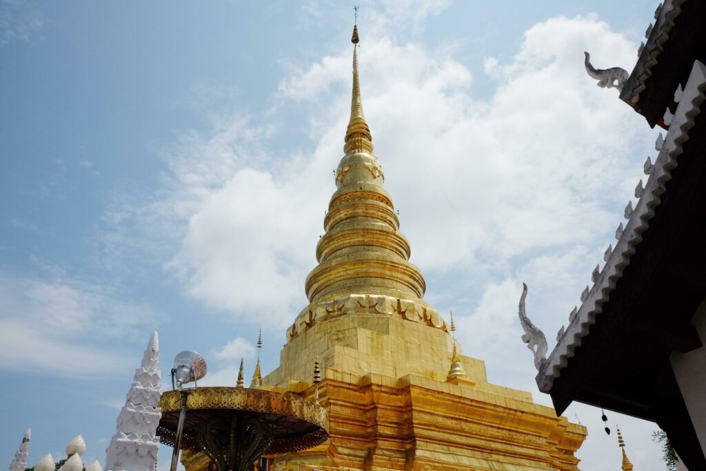 Beautiful Ancient grand golden pagoda of Wat Pumin Pratad Temple in northern of Thailand Stock Free