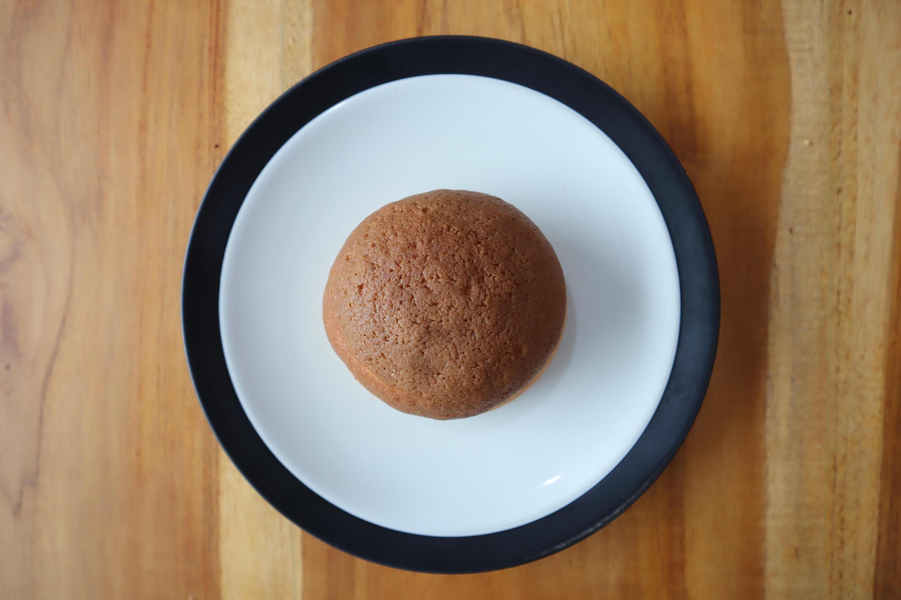 A plate of Sweet Chocolate bread on table background Stock Free