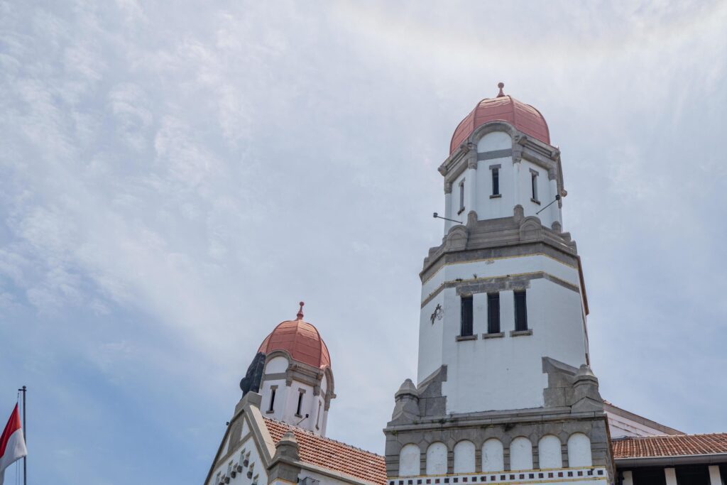 Tower on old mansion of Semarang Central Java with blue sky. The photo is suitable to use for travel destination, holiday poster and travel content media. Stock Free