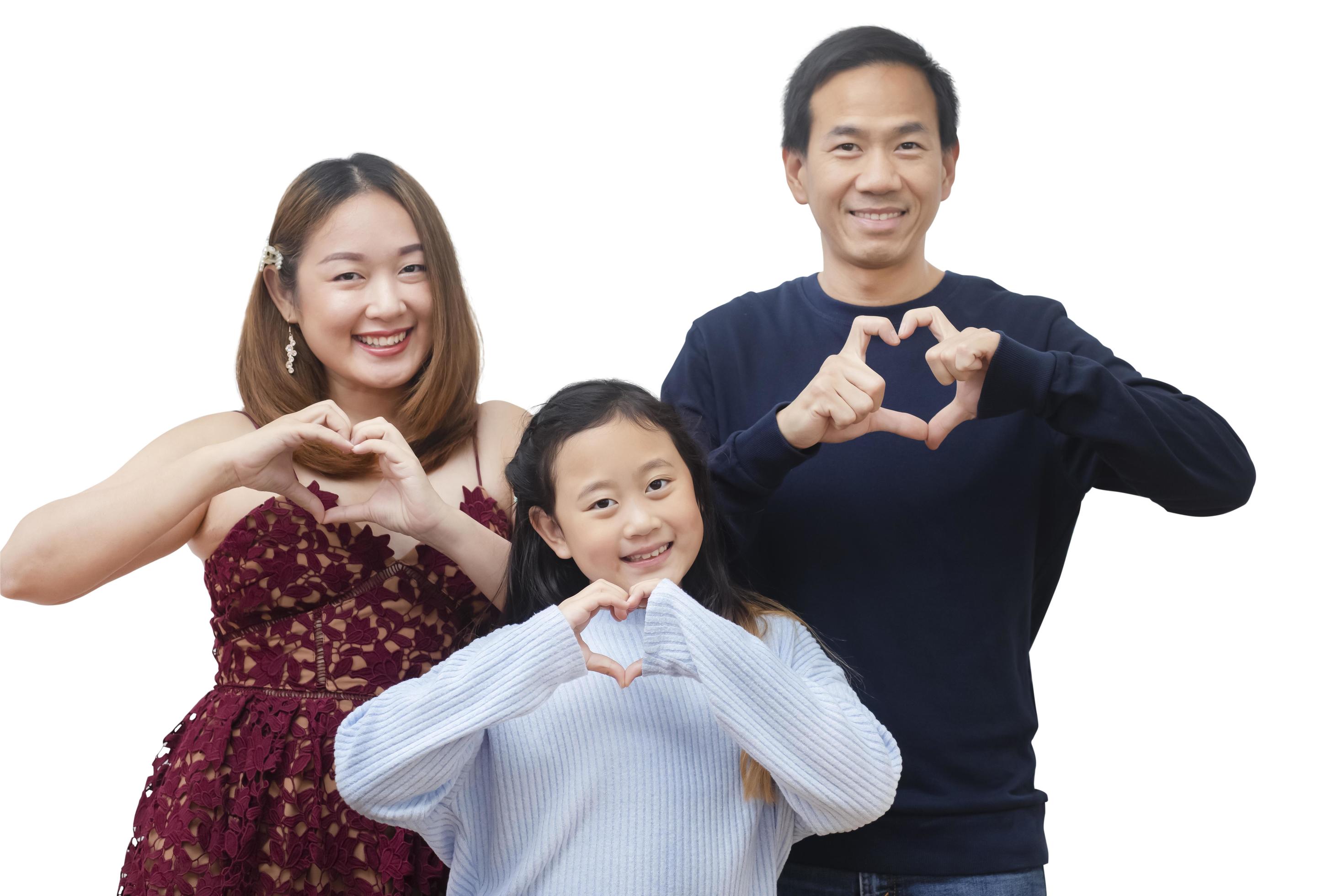 Asian family woman and a man with little junior woman smiling and fun isolated over white background Stock Free